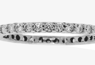 0.55 CT TW COMMON-PRONG STYLE WEDDING RING 14K WG